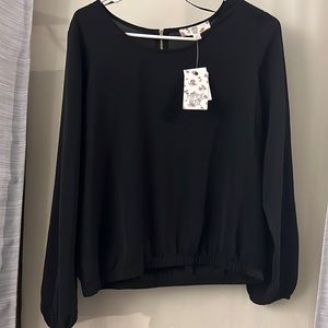 Black long sleeve blouse. NWT size medium